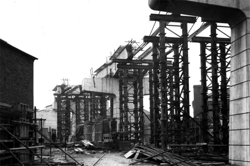 Construction of concrete road piers looking back from Handley St towards Ashridge St. 1960. https://picturehalton.org.uk/