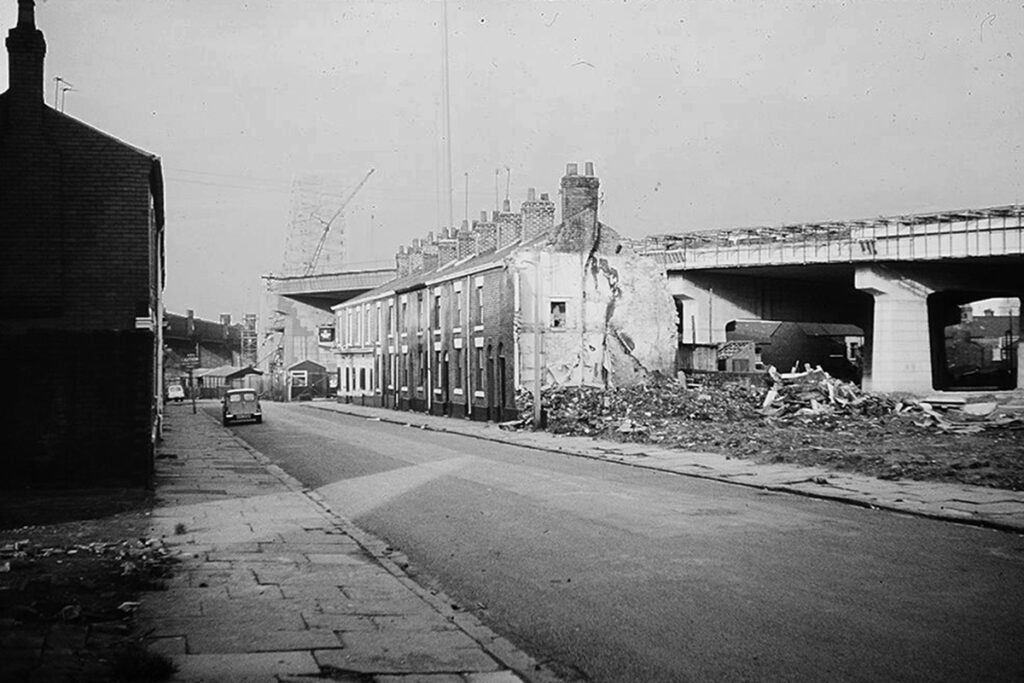 Demolition of west east side of Ashridge St as part of sliproad approach expansion works to Runcorn Bridge circa 1975.